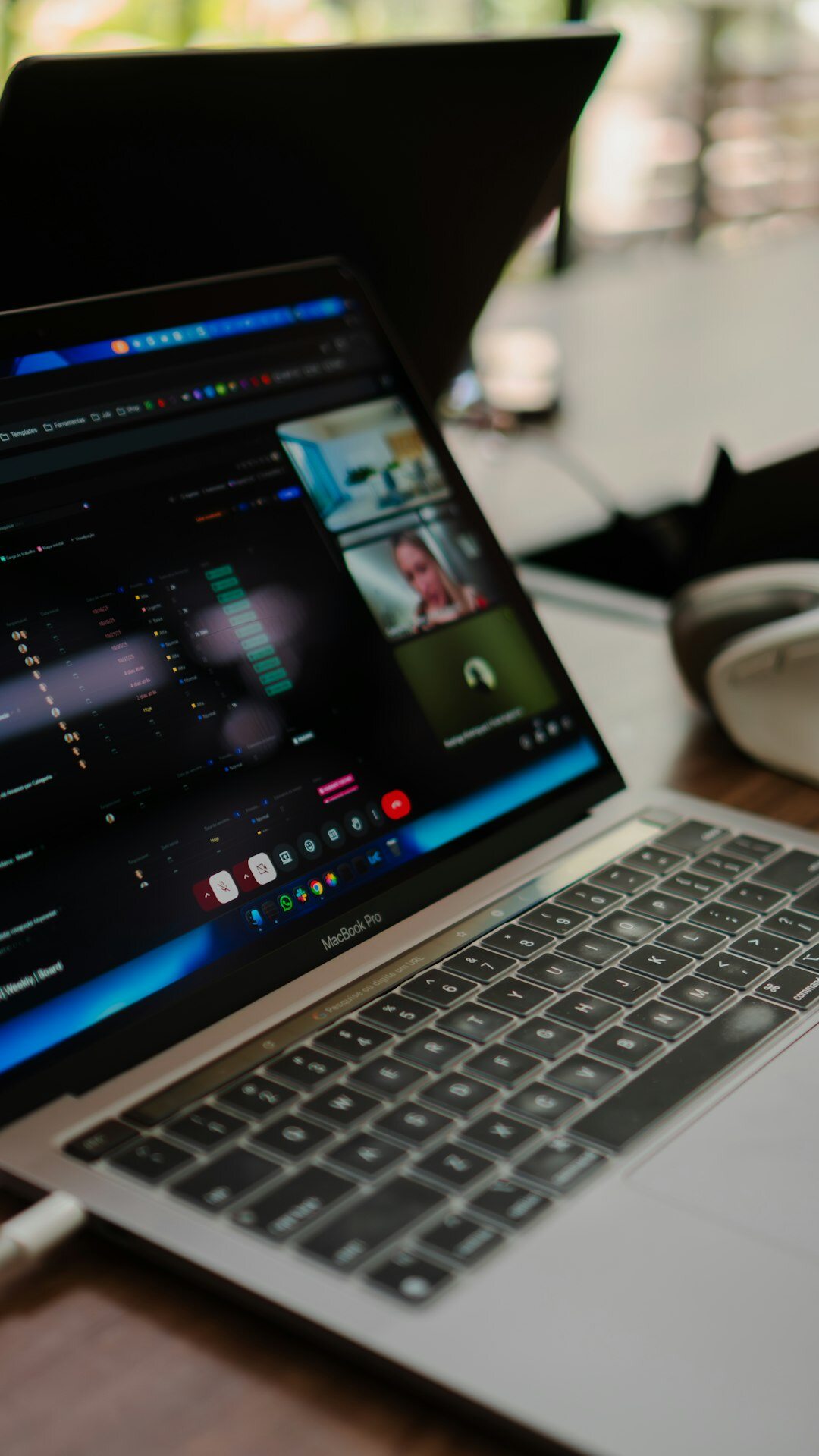 filmmaker editing video on laptop