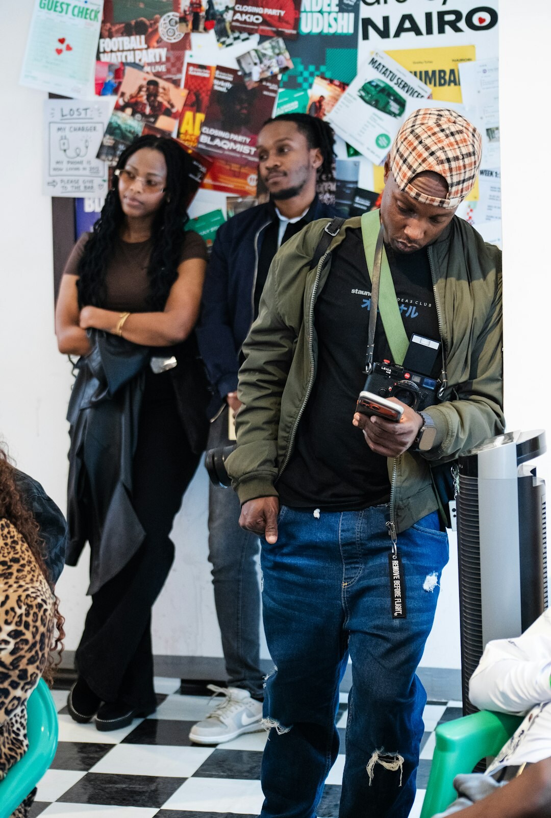 Group of adults discussing documents and laptops during a media literacy workshop